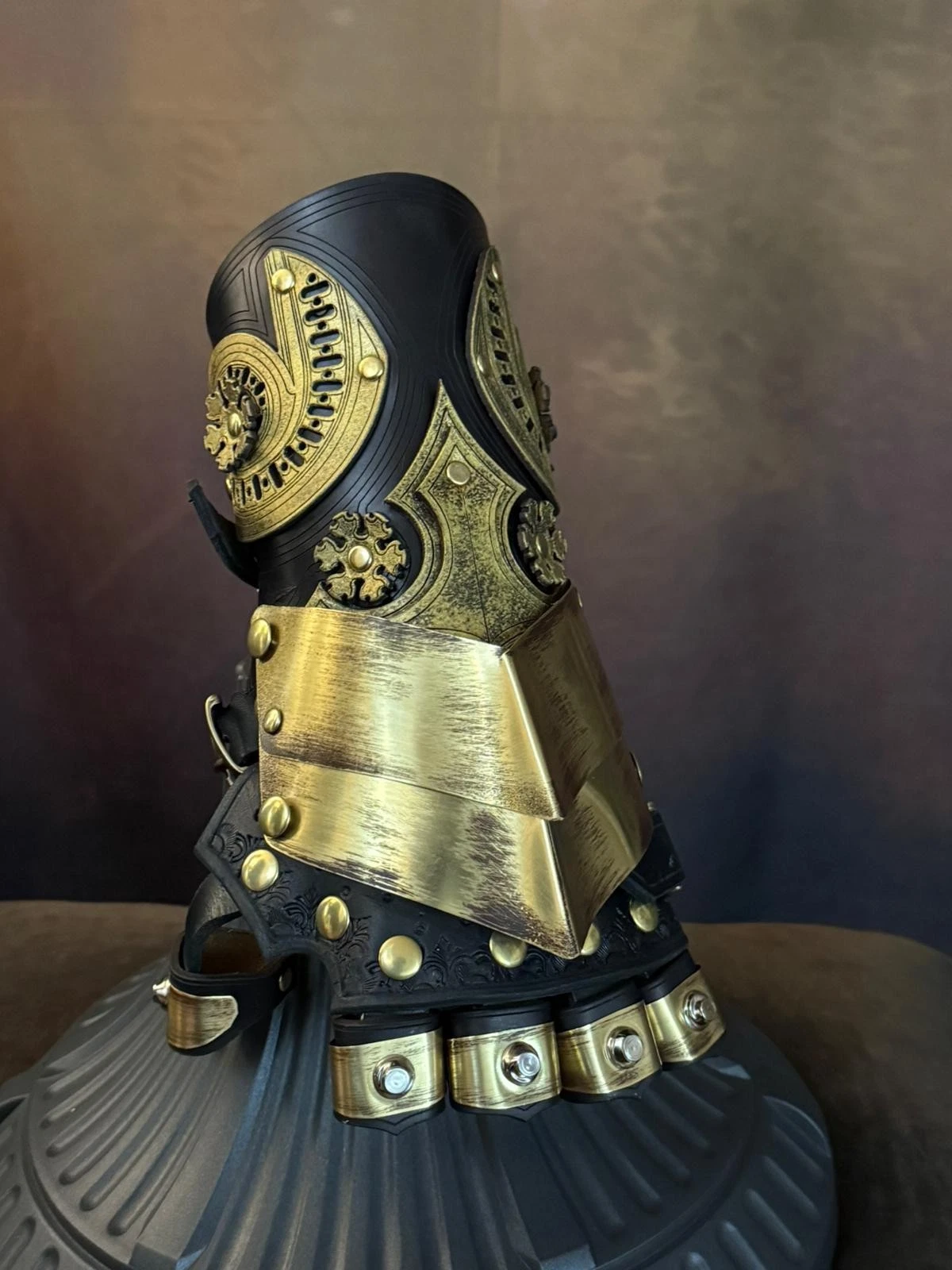 Baroque steampunk gauntlet in brass and leather with ornate decorations